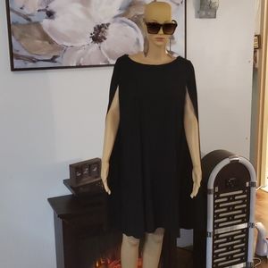 Black knee-length dress with bat-wing sleeves